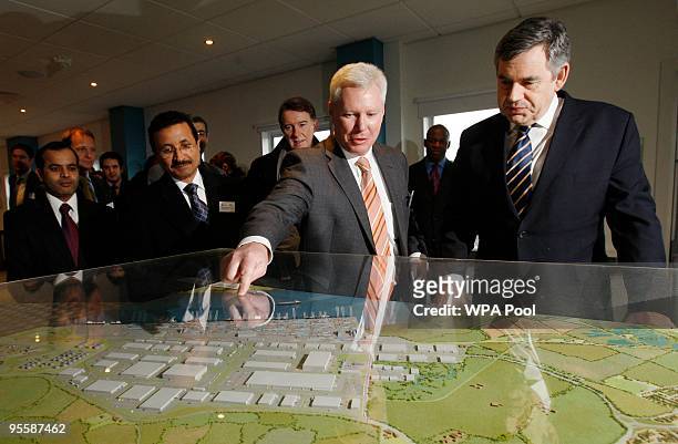 Britain's Prime Minister Gordon Brown views a scale model of the DP World London Gateway with CEO London Gateway Simon Moore , DP World chairman...