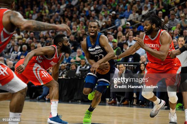 Andrew Wiggins of the Minnesota Timberwolves drives to the basket against James Harden and Nene Hilario of the Houston Rockets in Game Four of Round...