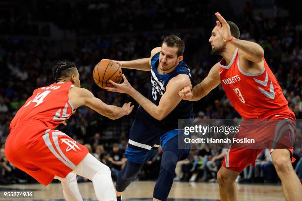 Nemanja Bjelica of the Minnesota Timberwolves drives to the basket against Gerald Green and Ryan Anderson of the Houston Rockets in Game Four of...