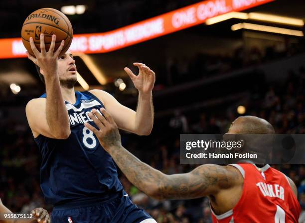 Nemanja Bjelica of the Minnesota Timberwolves shoots the ball against PJ Tucker of the Houston Rockets in Game Four of Round One of the 2018 NBA...