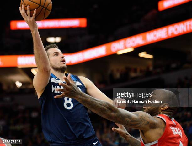Nemanja Bjelica of the Minnesota Timberwolves shoots the ball against PJ Tucker of the Houston Rockets in Game Four of Round One of the 2018 NBA...