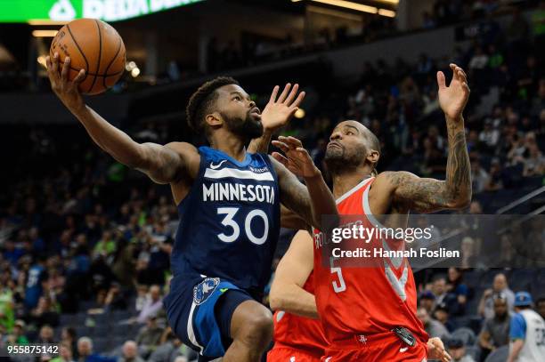 Aaron Brooks of the Minnesota Timberwolves shoots the ball against Aaron Jackson of the Houston Rockets in Game Four of Round One of the 2018 NBA...