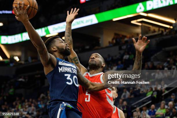 Aaron Brooks of the Minnesota Timberwolves shoots the ball against Aaron Jackson of the Houston Rockets in Game Four of Round One of the 2018 NBA...