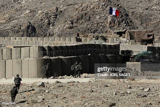 French soldiers from the OMLT of the Kandak 32 walk to a combat outpost in the Alah Say valley in Kapisa province on January 4, 2010. France warned...