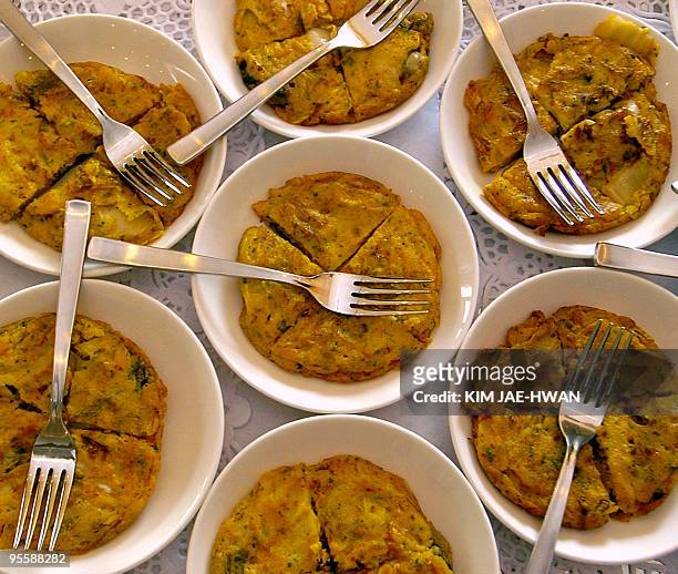 Plates of Kimchi galette are displayed at a French-Korean food exhibition at Le Cordon Bleu Korea in Seoul, 19 Ocotober 2004. The event was part of...