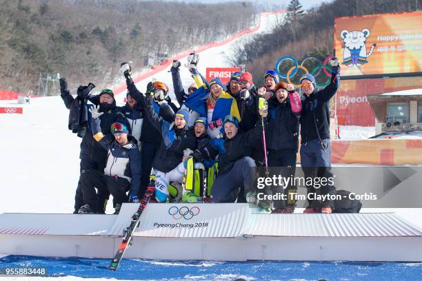 Frida Hansdotter of Sweden celebrates with Swedish team members after winning the gold medal during the Alpine Skiing - Ladies' Slalom competition at...