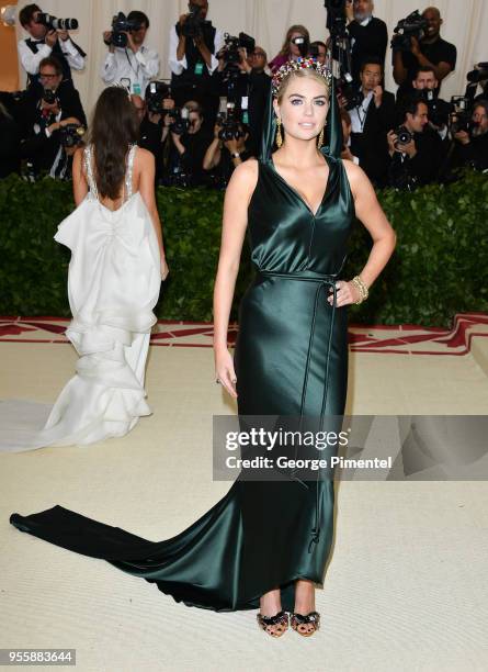 Kate Upton attends the Heavenly Bodies: Fashion & The Catholic Imagination Costume Institute Gala at Metropolitan Museum of Art on May 7, 2018 in New...