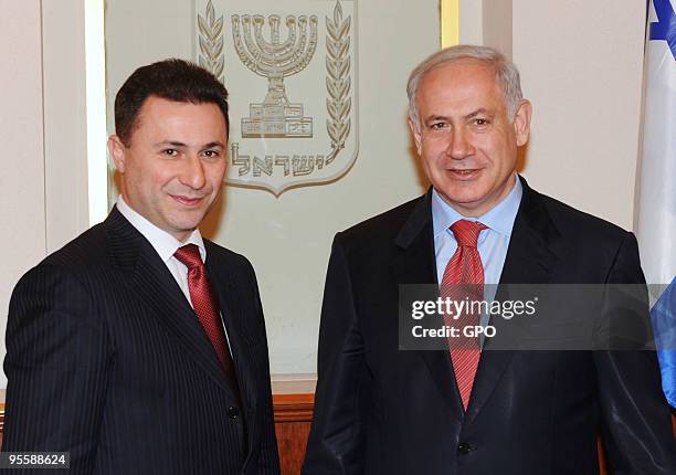In this handout image supplied by the Israeli Government Press Office , Israeli Prime Minister Benjamin Netanyahu poses for a photograph with the...