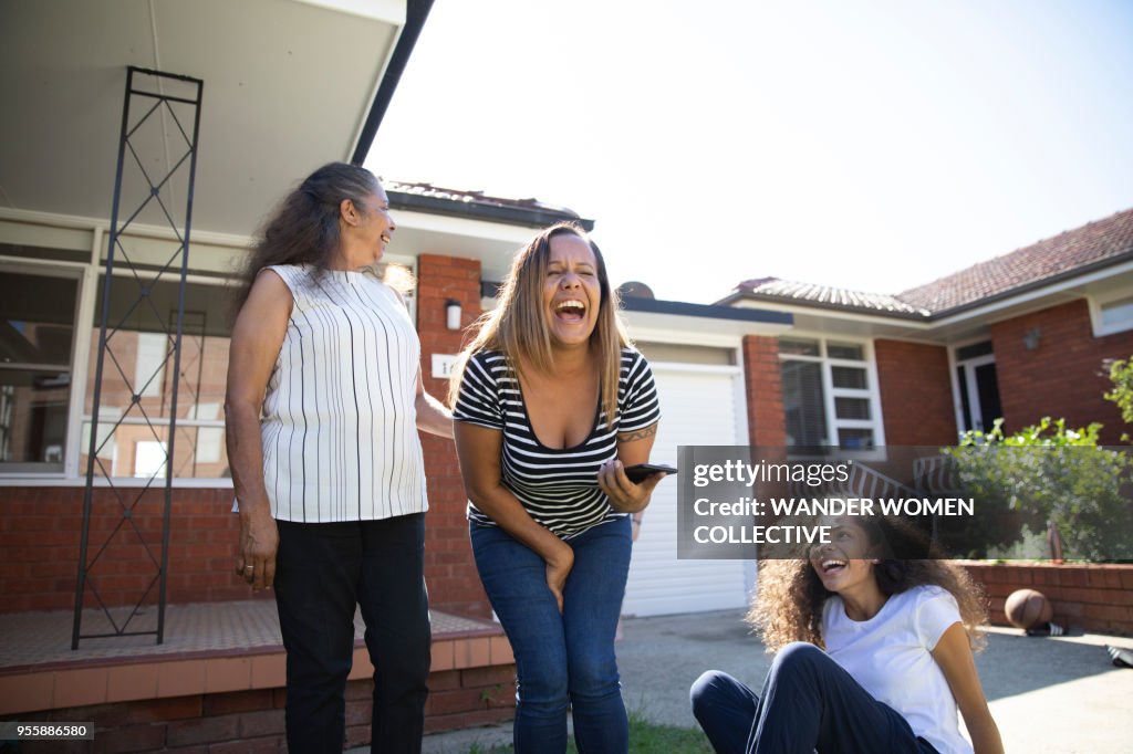 Three generations of Indigenous Australian Aboriginal woman laughing