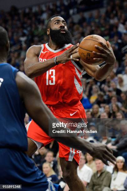 James Harden of the Houston Rockets shoots the ball against Gorgui Dieng of the Minnesota Timberwolves in Game Three of Round One of the 2018 NBA...
