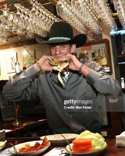 Professional Bull Rider J.B. Mauney unveils the PBR Bull Bucking Hero at the Stage Deli on January 5, 2010 in New York City.