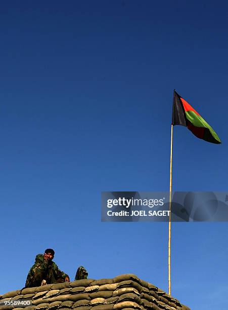 An Afghan National Army soldier of the Operational Mentoring and Liaison Teams of the Kandak 32 points at the Combat Out Position Shekhut in the Alah...