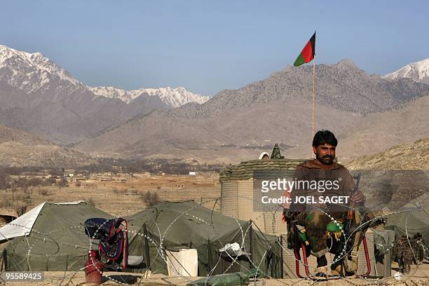 An Afghan National Army soldier of the Operational Mentoring and Liaison Teams of the Kandak 32 takes sentry duty at the Combat Out Position Shekhut...