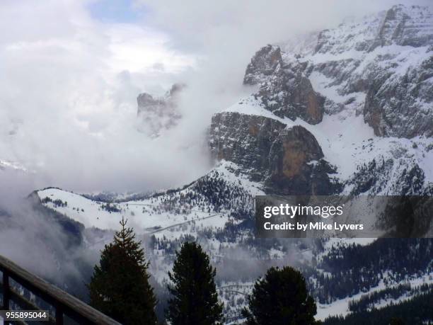 late winter storm engulfs the sella massif - engulfs stock pictures, royalty-free photos & images