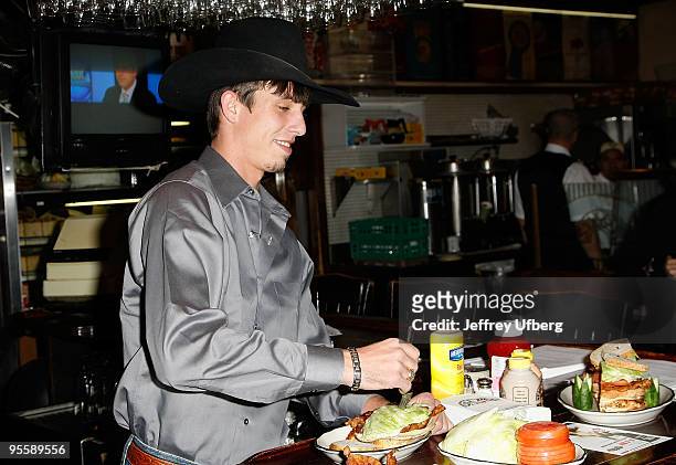 S 2009 World Champ runner up J.B. Mauney unveils the PBR Bull Bucking Hero at the Stage Deli on January 5, 2010 in New York City.