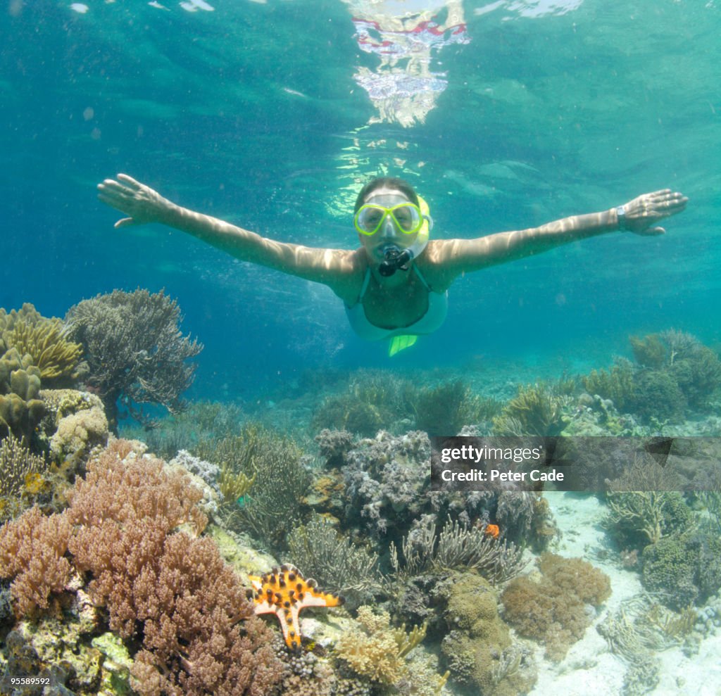 Woman swimming underwater