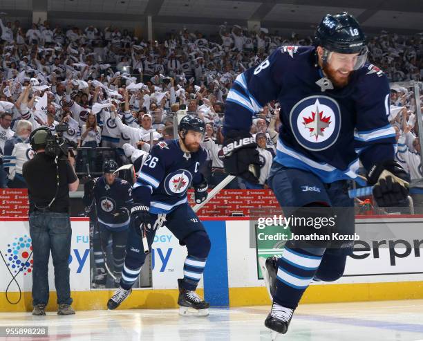 Bryan Little and Blake Wheeler of the Winnipeg Jets hit the ice prior to puck drop against the Nashville Predators in Game Four of the Western...
