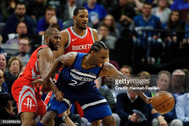Chris Paul and Trevor Ariza of the Houston Rockets defend against Andrew Wiggins of the Minnesota Timberwolves in Game Three of Round One of the 2018...