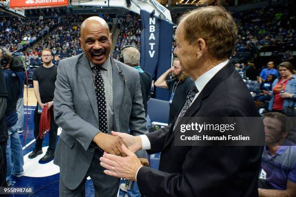 Coach John Lucas of the Houston Rockets shakes hands with Glen Taylor, owner of the Minnesota Timberwolves at halftime in Game Three of Round One of...