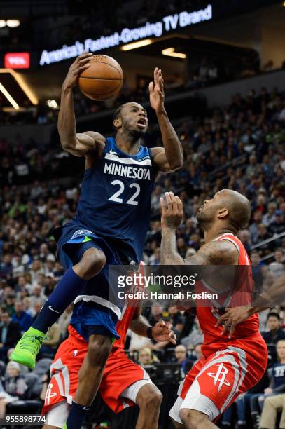 Andrew Wiggins of the Minnesota Timberwolves shoots the ball against PJ Tucker of the Houston Rockets in Game Three of Round One of the 2018 NBA...