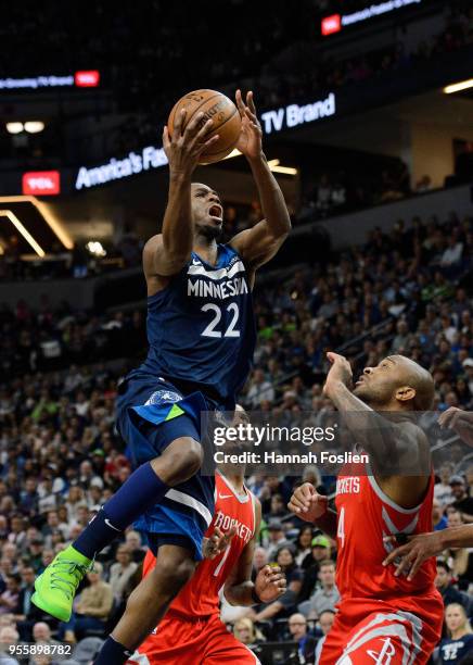 Andrew Wiggins of the Minnesota Timberwolves shoots the ball against PJ Tucker of the Houston Rockets in Game Three of Round One of the 2018 NBA...