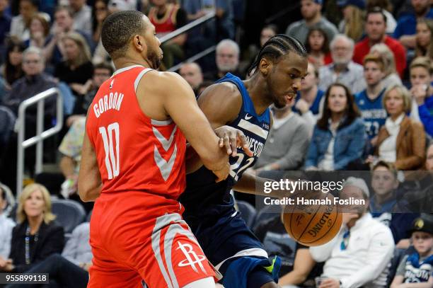 Andrew Wiggins of the Minnesota Timberwolves drives to the basket against Eric Gordon of the Houston Rockets in Game Three of Round One of the 2018...