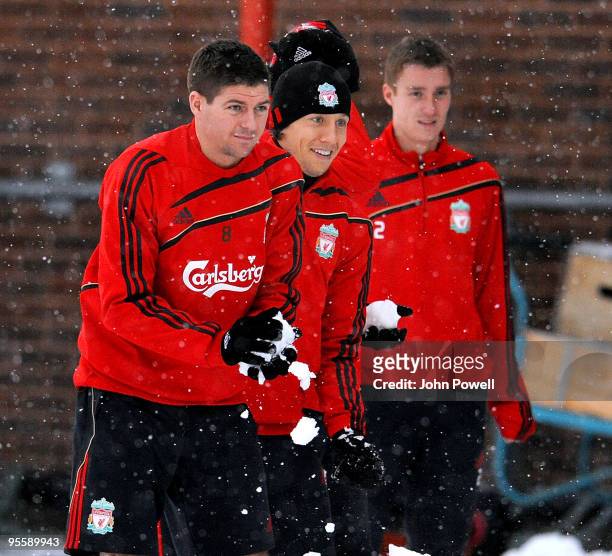 Steven Gerrard, Lucas Leiva and Stephen Darby play in the snow during a training session at Melwood Training Ground on January 5, 2010 in Liverpool,...