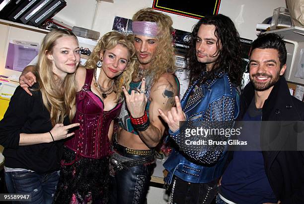 Amanda Seyfried, Kerry Butler, James Carpinello, Constantine Maroulis and Dominic Cooper pose backstage at the hit rock musical "Rock of Ages" on...