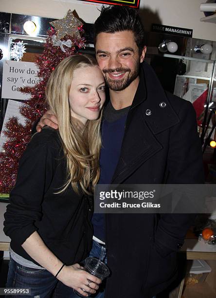 Amanda Seyfried and boyfriend Dominic Cooper pose backstage at the hit rock musical "Rock of Ages" on Broadway at The Brooks Atkinson Theater on...
