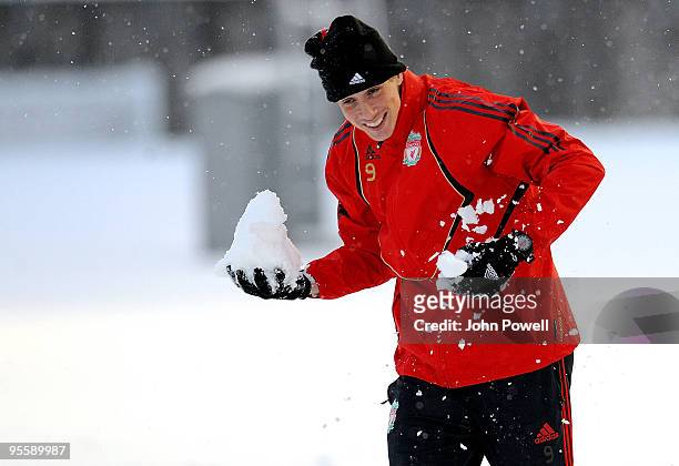 Fernando Torres enjoys the snowfall during a training session at Melwood Training Ground on January 5, 2010 in Liverpool, England.