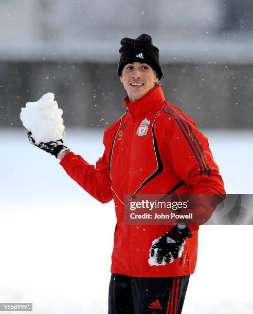 Fernando Torres enjoys the snowfall during a training session at Melwood Training Ground on January 5, 2010 in Liverpool, England.