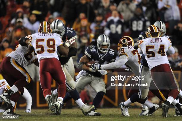 Marion Barber of the Dallas Cowboys runs the ball during the game against the Washington Redskins at FedExField on December 27, 2009 in Landover,...