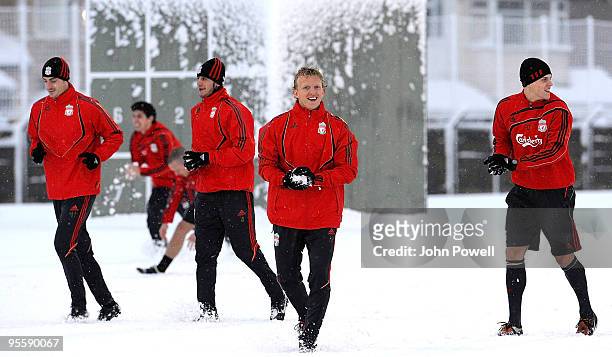 Albert Riera, Alberto Aquilani, Dirk Kuyt and Martin Skrtel train in the snow during a training session at Melwood Training Ground on January 5, 2010...