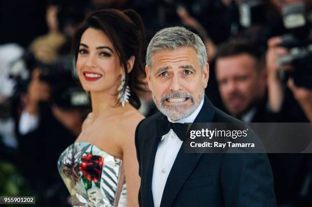 Lawyer Amal Clooney and actor George Clooney enter the Heavenly Bodies: Fashion & The Catholic Imagination Costume Institute Gala at The Metropolitan...