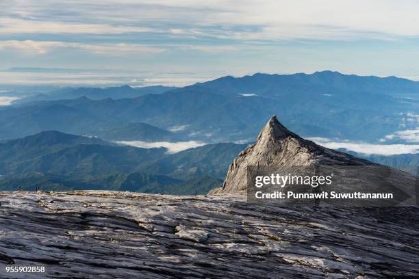south peak, iconic peak of kinabalu mountain massif in boneo island, sabah, malaysia - cliff texture ストックフォトと画像