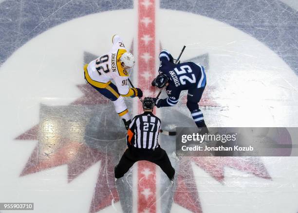 Ryan Johansen of the Nashville Predators takes a second period face-off against Paul Stastny of the Winnipeg Jets in Game Four of the Western...