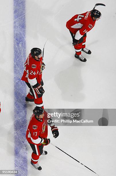 Chris Campoli;Anton Volchenkov and Filip Kuba of the Ottawa Senators stand along the blueline during warmup before a game against the Philadelphia...