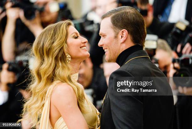 Professional football player Tom Brady and Gisele Bundchen enter the Heavenly Bodies: Fashion & The Catholic Imagination Costume Institute Gala at...