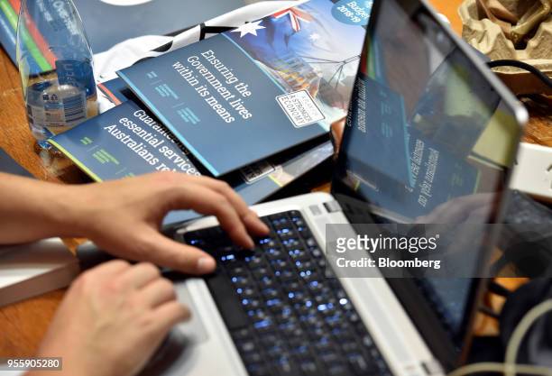 Member of the media works inside the budget lock-up at Parliament House in Canberra, Australia, on Tuesday, May 8, 2018. With elections due within a...