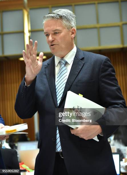 Mathias Cormann, Australia's finance minister, speaks to members of the media, not pictured, inside the budget lock-up at Parliament House in...