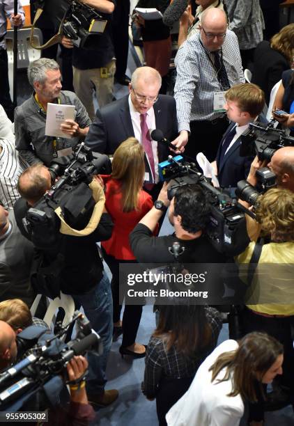 Scott Morrison, Australia's treasurer, center, speaks to members of the media inside the budget lock-up at Parliament House in Canberra, Australia,...