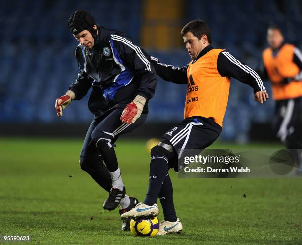 Joe Cole and Petr Cech of Chelsea in action during a training session at Stamford Bridge on January 5, 2010 in London, England.