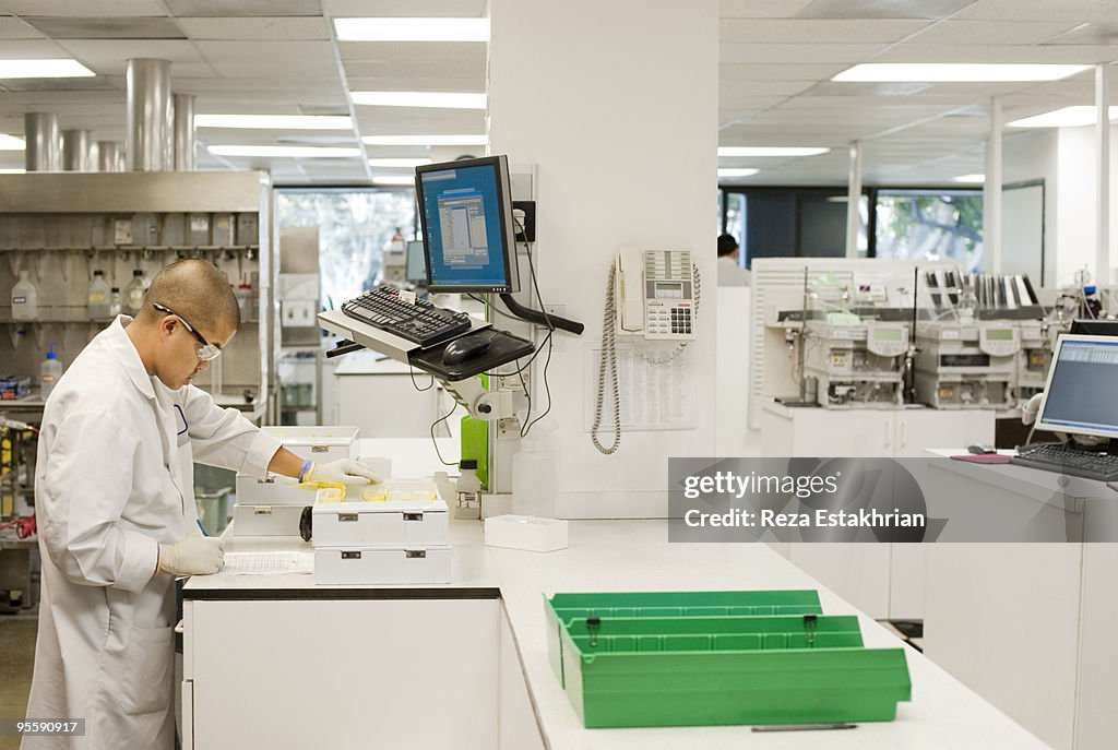 Lab worker checking test results