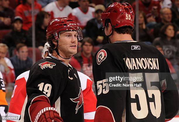 Shane Doan of the Phoenix Coyotes talks to teammate Ed Jovanovski during a time out against the Detroit Red Wings on January 2, 2010 at Jobing.com...