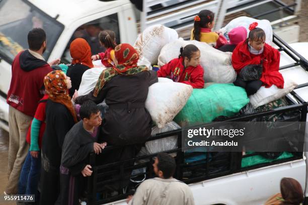 Syrian people wait to be evacuated in al-Rastan town of Homs to al-Bab district of Syria on May 8, 2018.