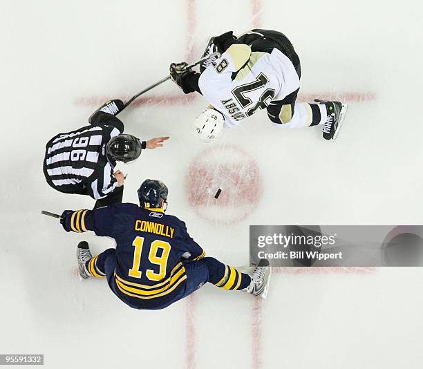 Sidney Crosby of the Pittsburgh Penguins takes a faceoff against Tim Connolly of the Buffalo Sabres on December 29, 2009 at HSBC Arena in Buffalo,...