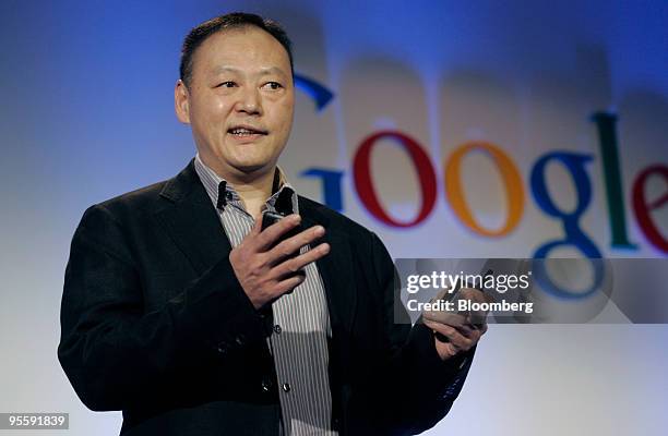 Peter Chou, chief executive officer of HTC Corp., holds the Google Nexus One touch-screen mobile phone his company will produce running the Android...