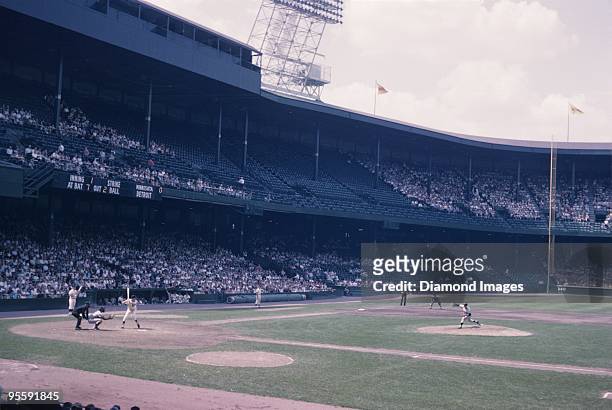Pitcher Camilo Pascual of the Washington Senators throws a pitch to outfielder Rocky Colavita of the Detroit Tigers during a game on August 21, 1963...