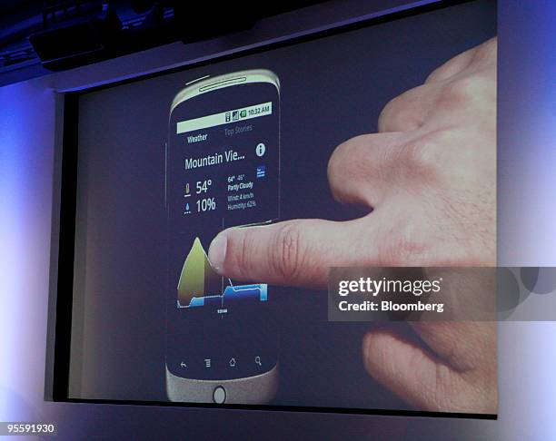 Screen shot of Erick Tseng, senior product manager for Google Inc., demonstrating a weather application on the Google Nexus One touch-screen mobile...
