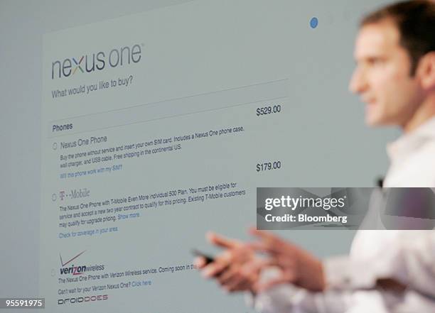 Mario Queiroz, vice president of product management for Google Inc., holds up the Google Nexus One touch-screen mobile phone during a news conference...